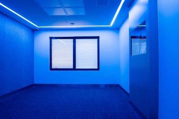 Sensory modulation room with blue lighting.