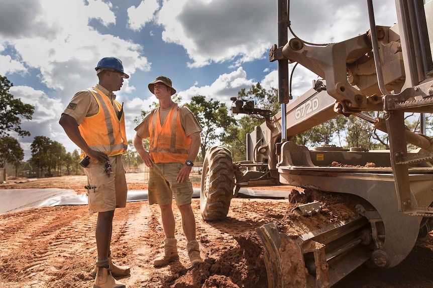 Lance Corporal Louis Maugueret and Corporal Jason Myers plan the next phase of construction.