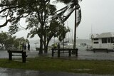 Floodwater pushes boats over a park at Gympie Terrace, Noosa, January 27, 2012.