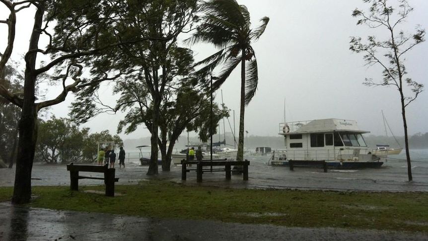 Floodwater pushes boats over a park at Gympie Terrace, Noosa, January 27, 2012.