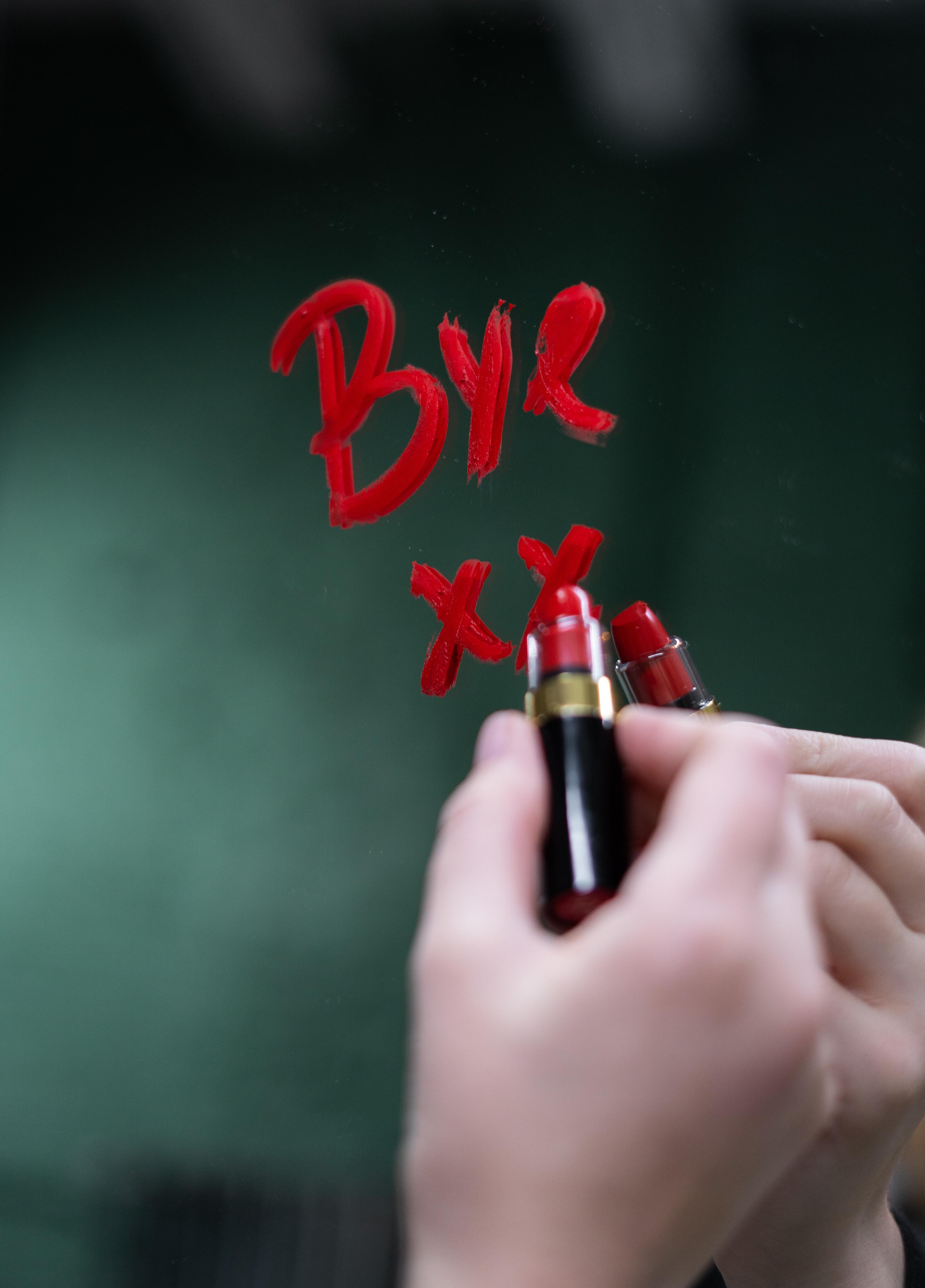 The word 'bye' written in lipstick on a mirror in a story about do break-ups show our true colours.