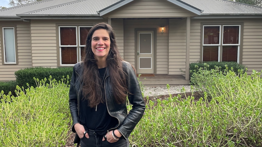 Ana Kresina stands in front of a house, for a story about the First Home Super Saver scheme.