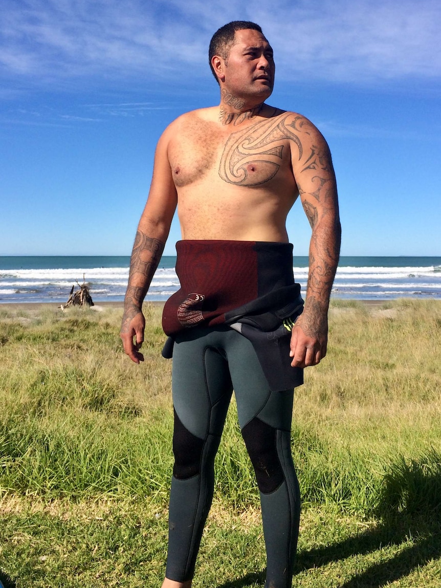 Deportee Ko Haapu standing beside the beach.