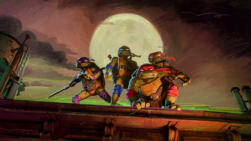 The four Teenage Mutant Ninja Turtles pose on a wall at night with the full moon behind them