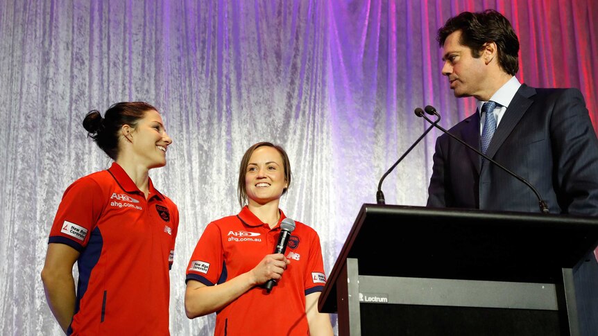 Melissa Hickey and Daisy Pearce of the Demons talk to AFL chief Gillon McLachlan