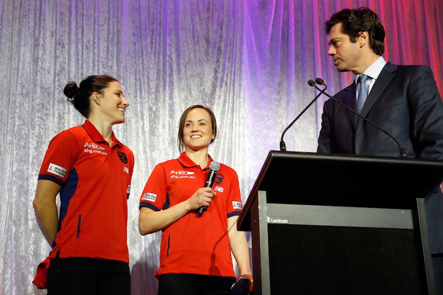 Melissa Hickey and Daisy Pearce of the Demons talk to AFL chief Gillon McLachlan