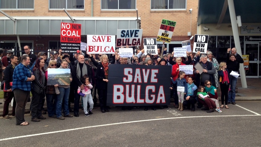 Bulga residents protesting outside a PAC meeting in Singleton