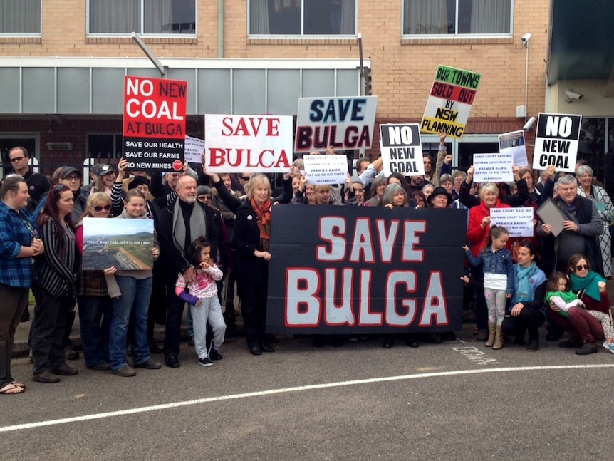 Bulga residents protesting outside a PAC meeting in Singleton