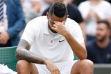 Australia's Nick Kyrgios sits disappointed after losing his match