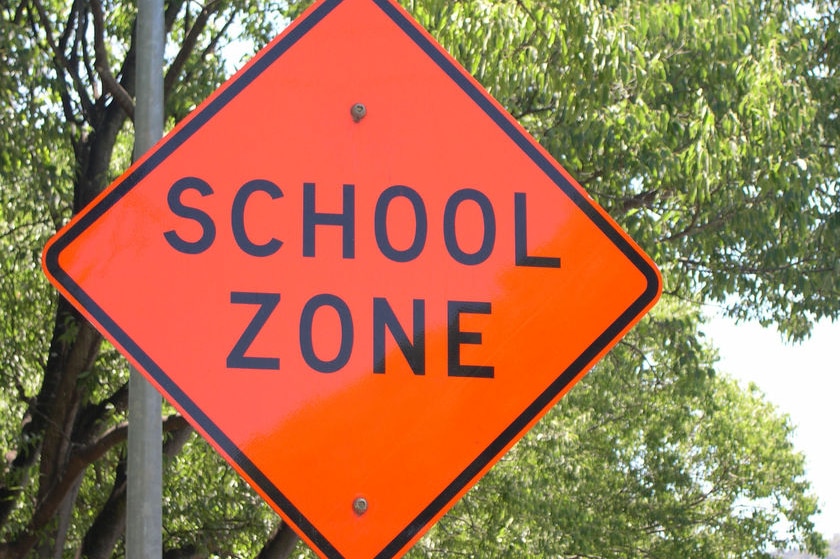 Sign saying 'School Zone' outside Canberra school - generic - indicating a 40 road speed limit