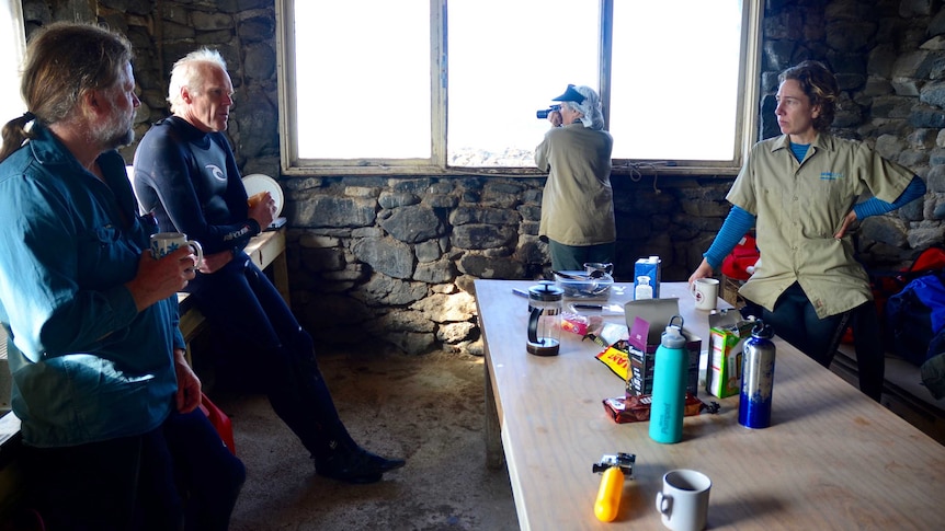 Rescuers take a break during their trip to Seal Rocks off the western tip of Phillip Island.