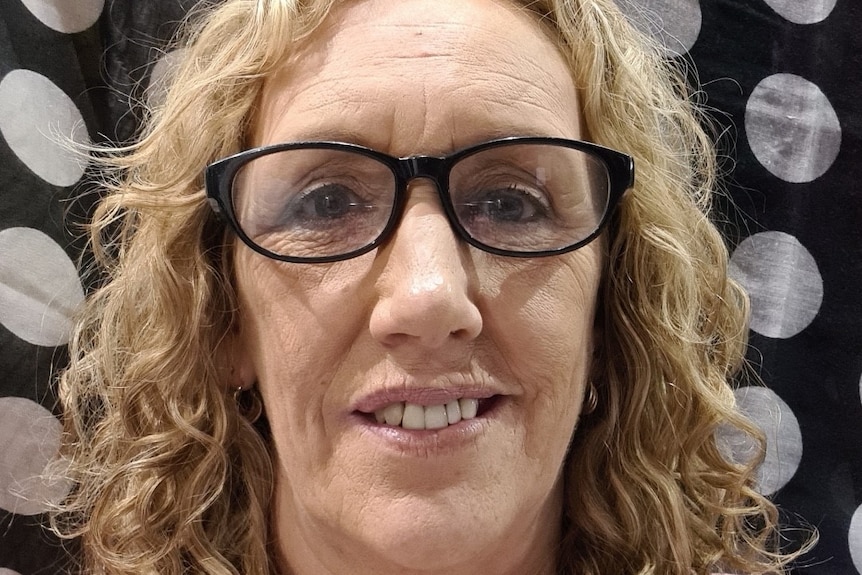 Debbie King wearing glasses.
