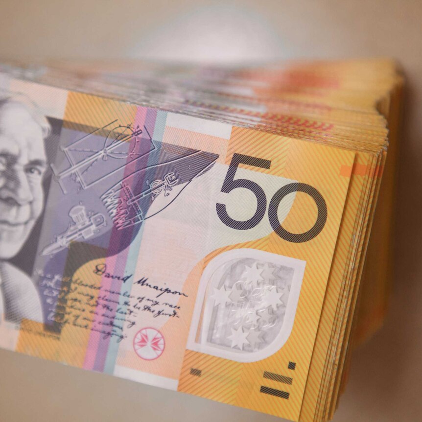 Stack of several thousand dollars worth of Australian $50 notes