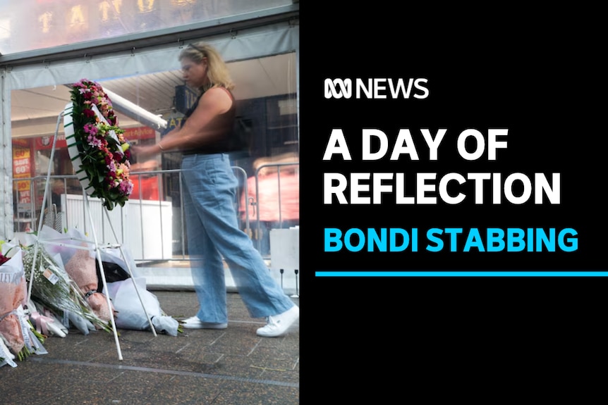A Day of Reflection, Bondi Stabbing: A woman approaches a floral tribute in a shopping plaza.