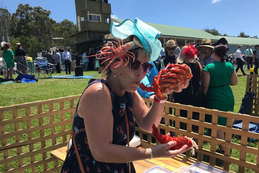 Devonport Cup racegoer eats a crayfish