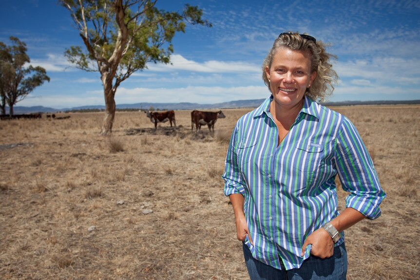 Fiona Simpson stands in a paddock.