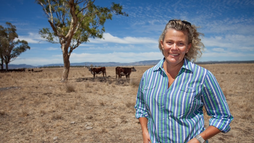 Fiona Simpson stands in a paddock.