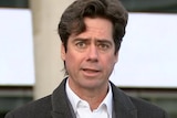 Gillon McLachlan speaks at a press conferences