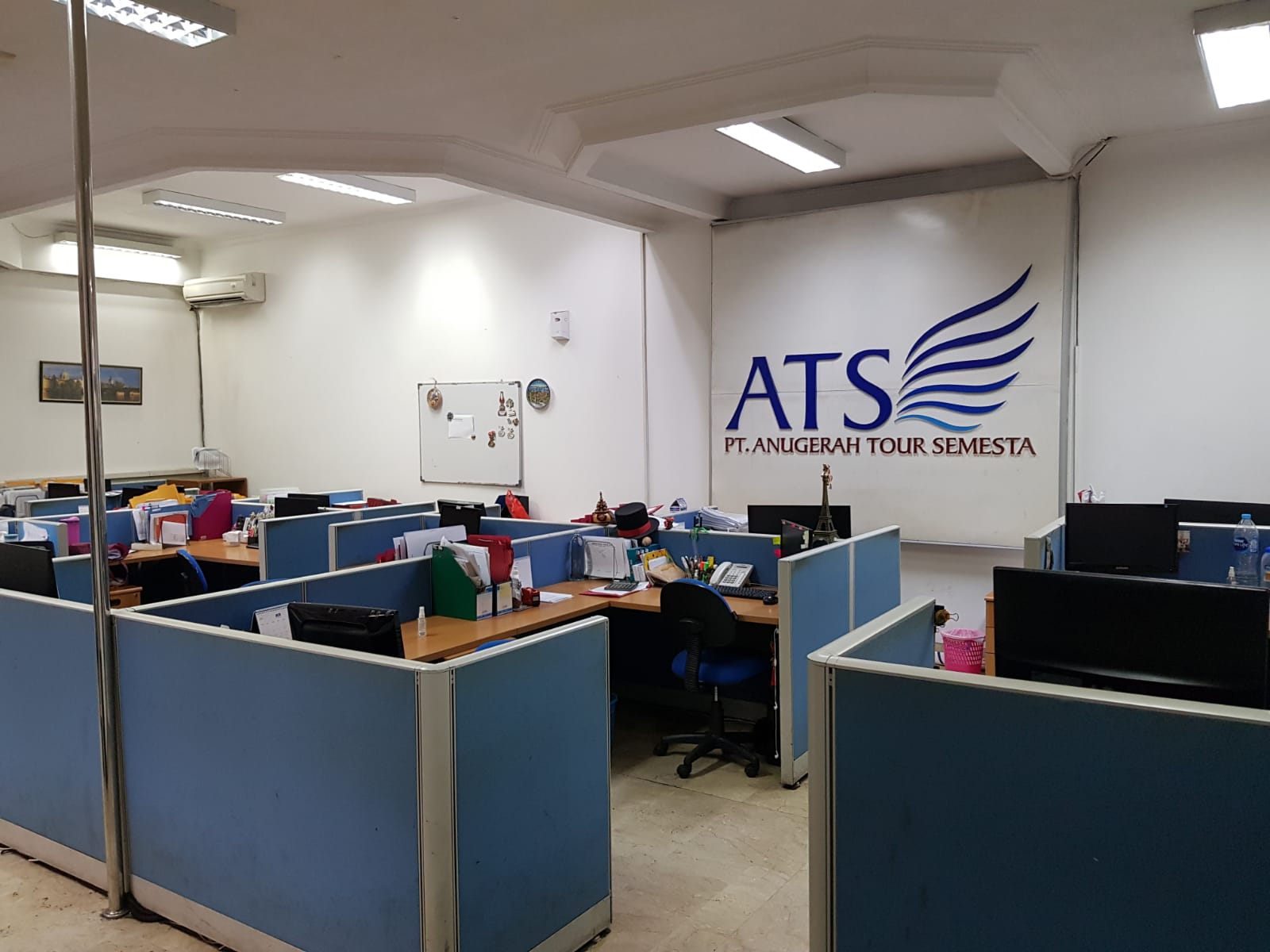 An office space with ATS written on the wall