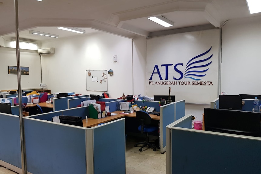 An office space with ATS written on the wall