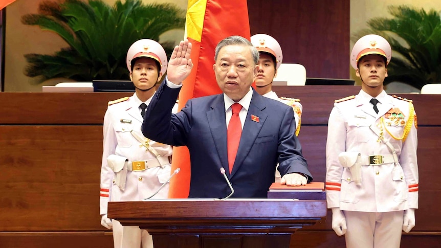 Vietnamese president To Lam behind lectern.