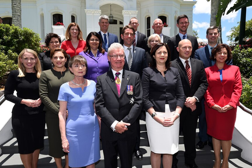 Queensland cabinet ministers pose for photo on the steps of Government House.