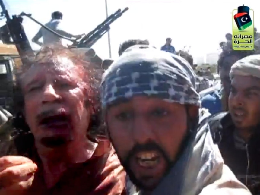 Gaddafi moments after his capture in Sirte on October 20