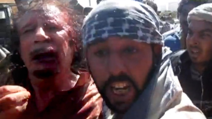 Gaddafi moments after his capture in Sirte on October 20