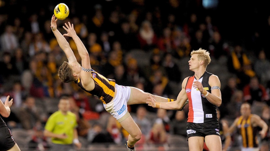 Hawthorn's Taylor Duryea takes a mark against St Kilda at Docklands.