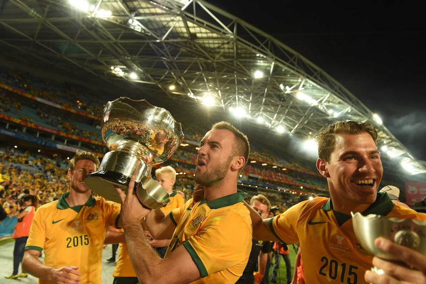 The Socceroos celebrate their win over South Korea in the Asian Cup final on January 31, 2015.