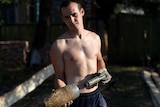 Ukrainian man holds rocket after ceasefire broken