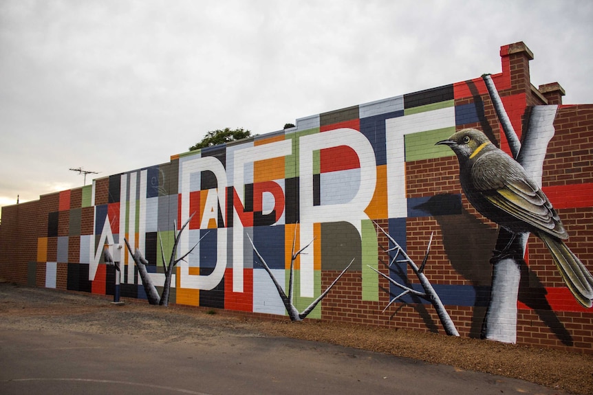 Image of a mural on the wall of a real estate agent in Kalgoorlie.