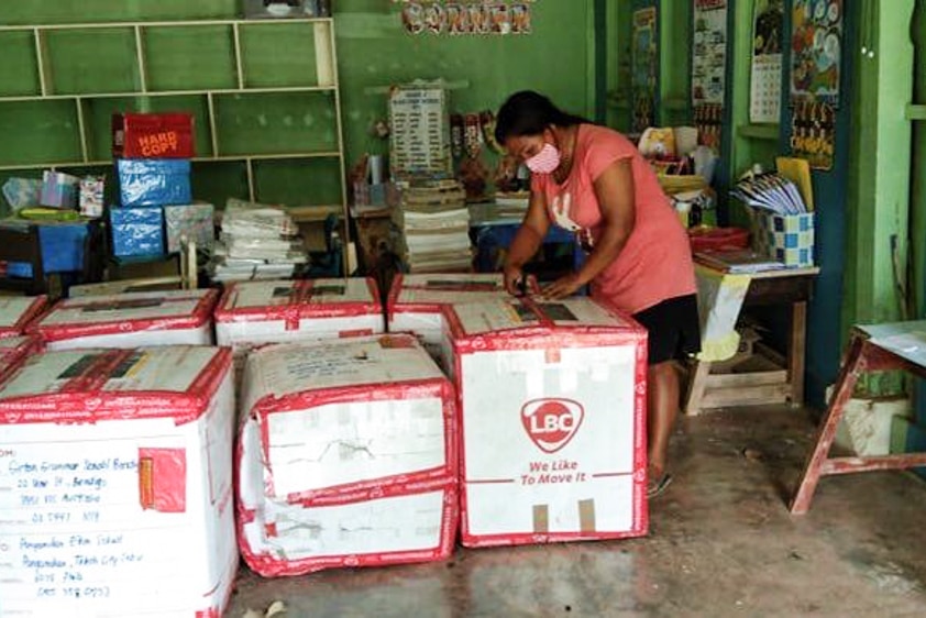 Unpacking uniforms at Pangamihan Elementary School