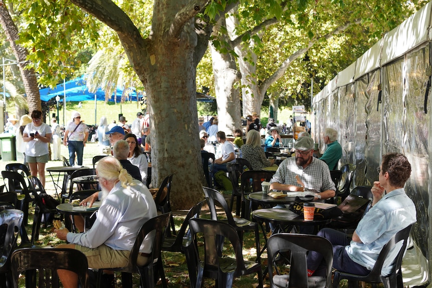 Audience members at Adelaide Writers' Week enjoy coffee and the shade. 