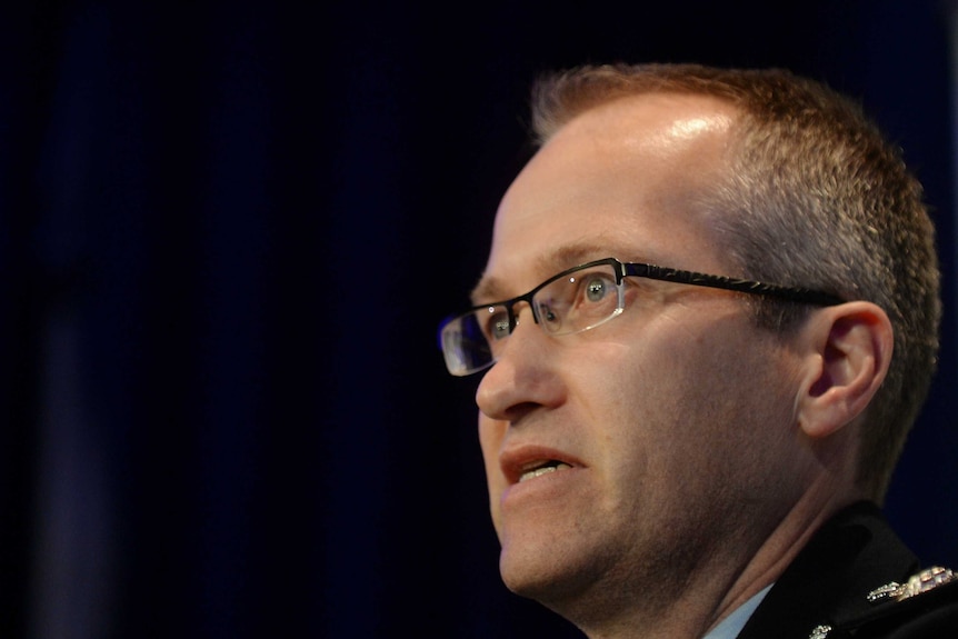 AFP Acting Assistant Commissioner Ian McCartney speaks to the media