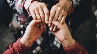 Close up of two hands holding