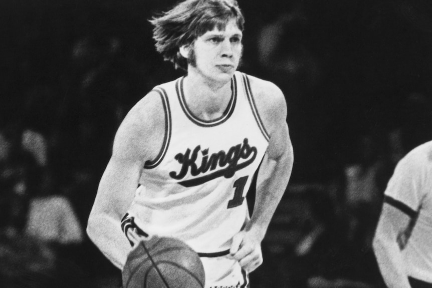 Bob Bigelow dribbles the ball in a black and white photo