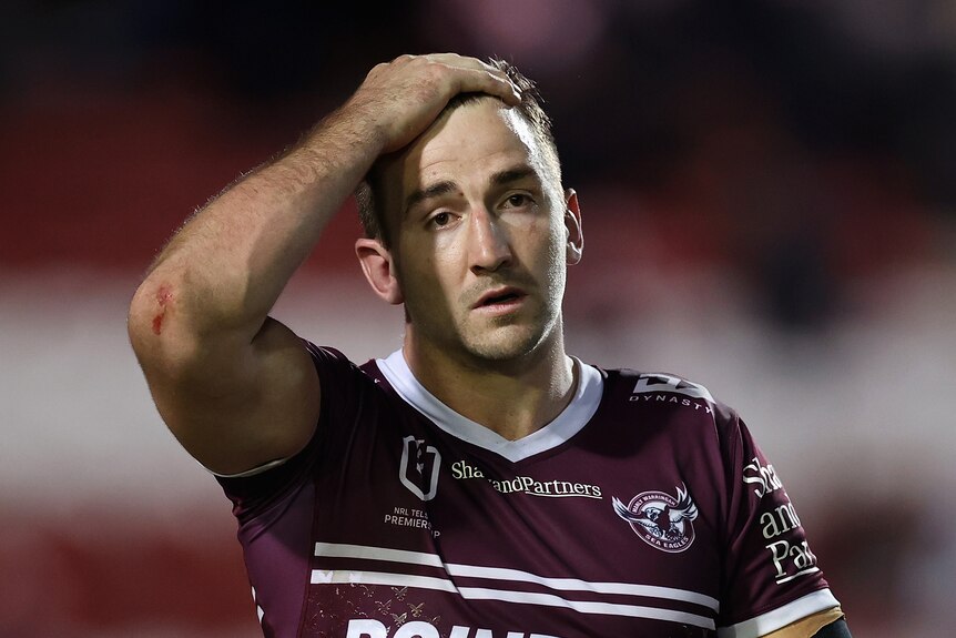 A man looks exasperated after losing a rugby league match 