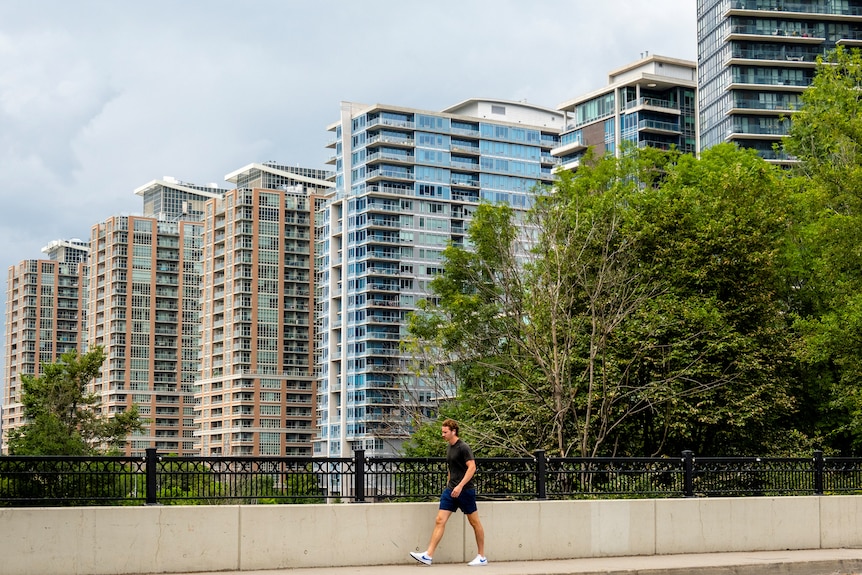 A number of large, tall buildings in the distance. 