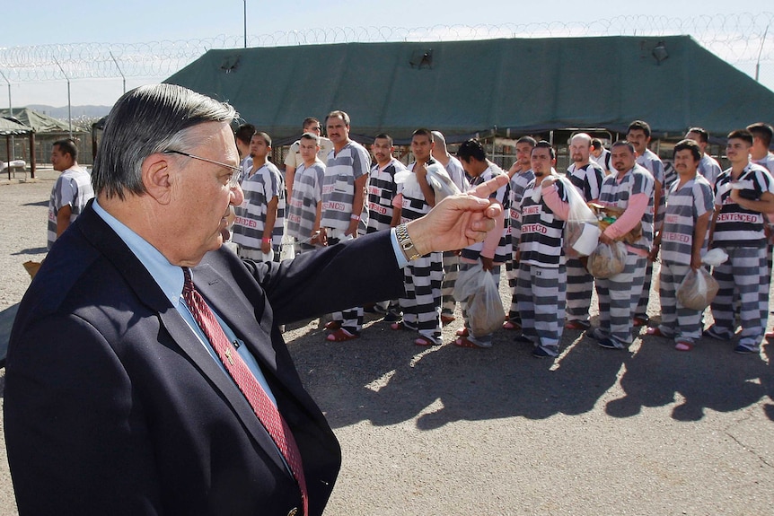 Joe Arpaio orders around approximately 200 convicted illegal immigrants handcuffed together at Tent City.
