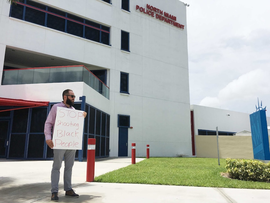 Man outside North Miami police station