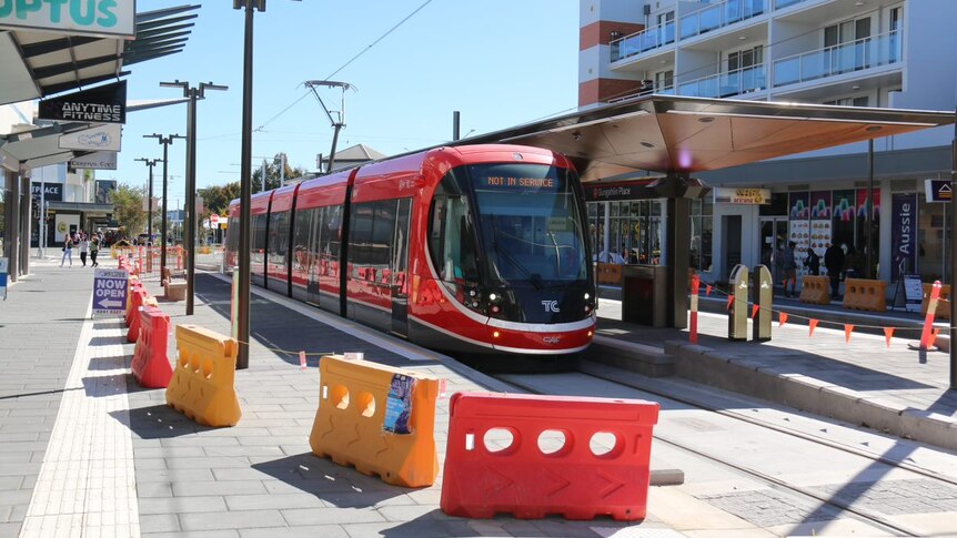 A light rail vehicle at the stop in Gungahlin town centre.