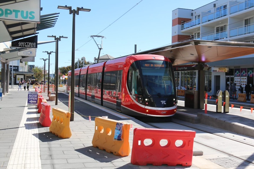 A light rail vehicle at the stop in Gungahlin town centre.