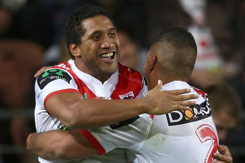 Kalifa Faifai Loa (L) is congratulated by Nene Macdonald on scoring his first try against the Warriors.