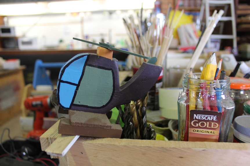 Close up photograph of handmade wooden helicopter at the Kempsey Men's Shed.