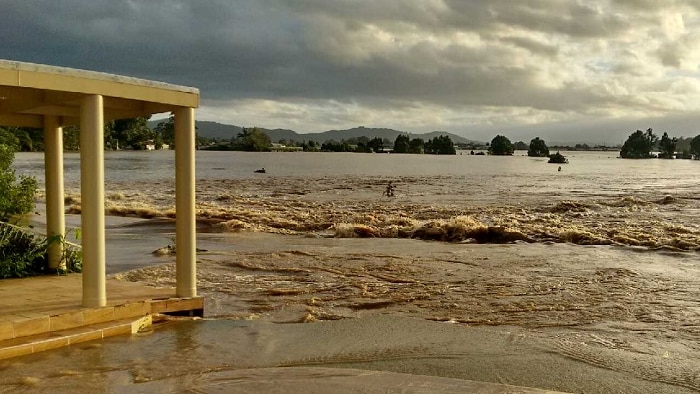 The flood water swirls around the second storey of a motel near Murwillumbah.