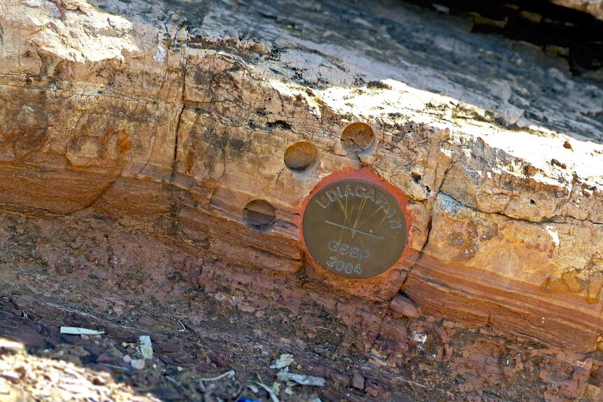 Plaque on rock marks transition from one geological era to another
