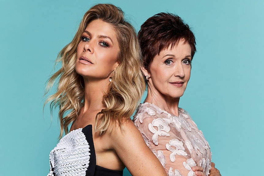 Natalie Bassingthwaighte and Jackie Woodburne pose for a publicity photo for Neighbours