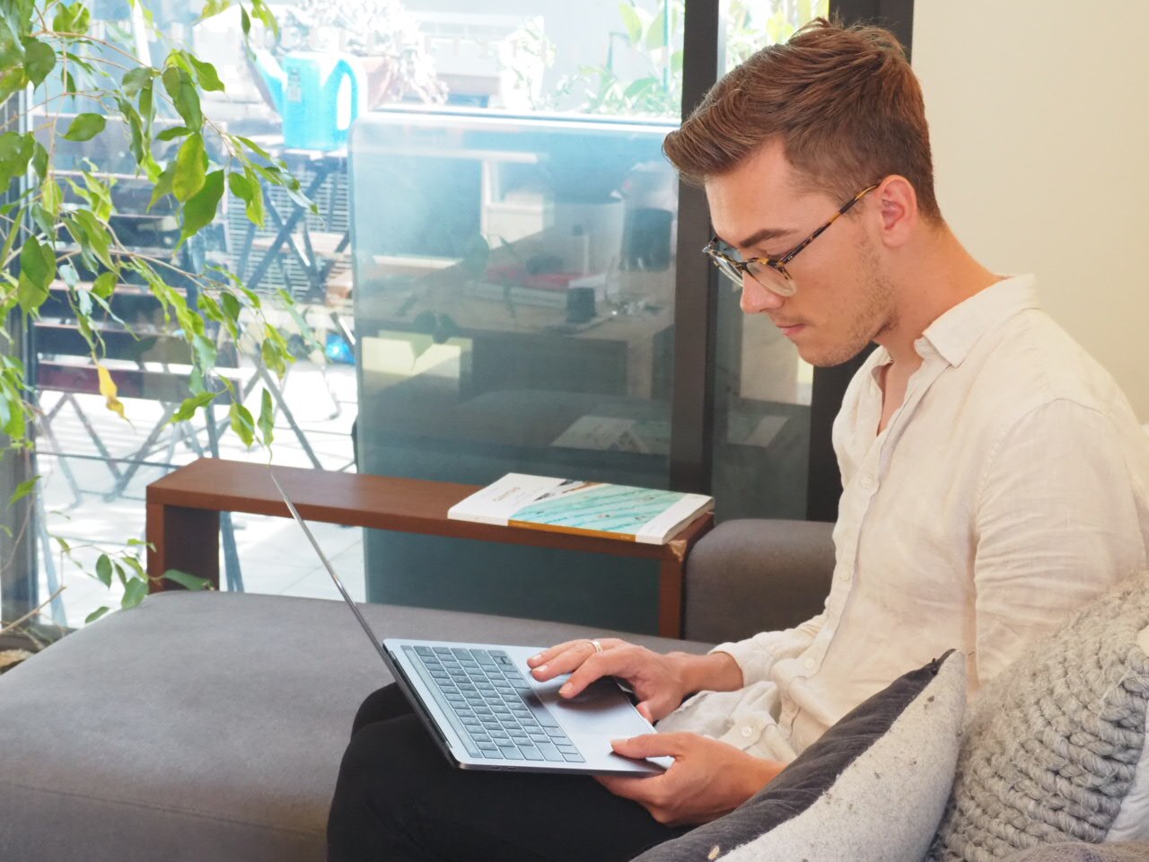 Glenn Turnham uses his laptop in his living room.