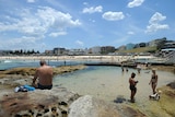 People enjoy the water at Bondi Beach in Sydney.